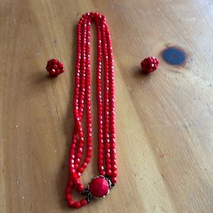 Red beaded necklace with matching clip on earrings